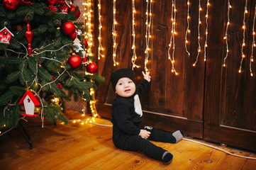 Happy fun child paying at home on Christmas time. Xmas holiday concept