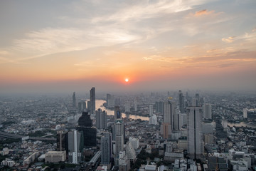 Naklejka na ściany i meble Bangkok cityscape at sunset. Urban sprawl with skyscrapers and hotels