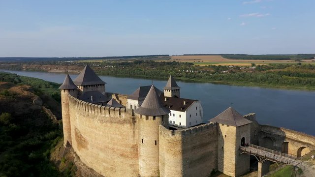 Aerial view of Hotyn medieval castle on the green hill above the river. Zoom in.