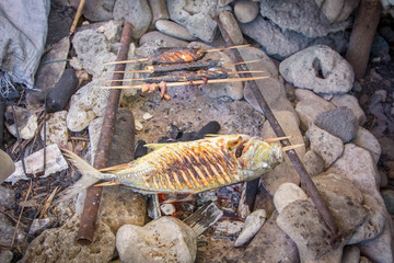 Asian traditional grilled fish in the evening
