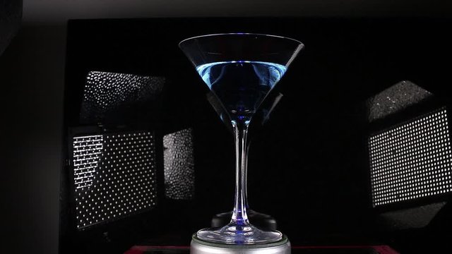 Fashion cocktail drink blue curacao on martini glass video