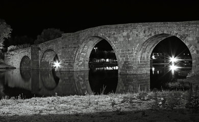 Old stone bridge at night, Spain