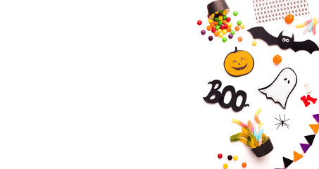 Fototapeta premium Halloween holiday background with flat lay of scary figures