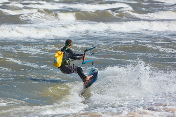 Kite surfer on the waves