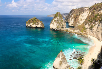 Panorama view of diamond beach in Nusa Penida Island. Bali, Indonesia. Landscape view of diamond beach with rocky and turquoise sea. diamond beach is tourist attraction. Travel concept