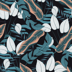 Seamless tropical pattern with bright white and blue leaves and plants on black background. Seamless exotic pattern with tropical plants. Exotic wallpaper.  Hawaiian style.