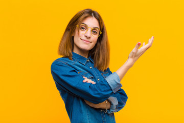 young pretty woman feeling confused and clueless, wondering about a doubtful explanation or thought...