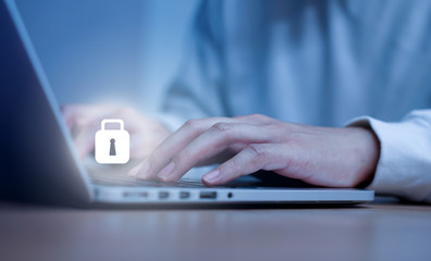 Close up man hand typing or working on laptop for programming about cyber security , advance future...
