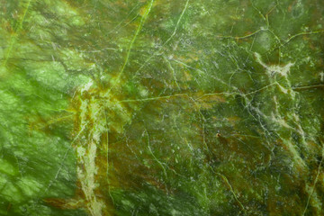 Green natural marble with brown veins in cracks, texture for ceramic tiles and floor tiles