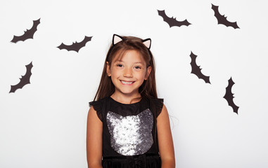 Attractive girl with cat ears and black bats