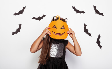 Funny kid with Jack o lantern mask