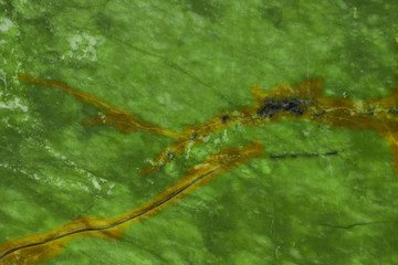 Green natural marble with brown veins in cracks, texture for ceramic tiles and floor tiles