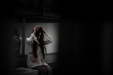 Portrait of asian woman make up ghost face with blood,Horror scene,Scary background,Halloween...