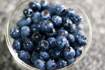 Some blueberries in a glass bowl