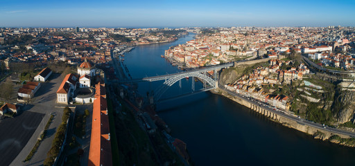 Aerial panorama view of Serra do Pilar Monastery and Dom Luis Bridge in Porto at morning, Portugal