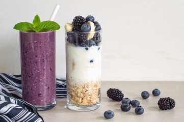 Smoothies of banana, blueberry, blackberry, oatmeal and yogurt and ingredients