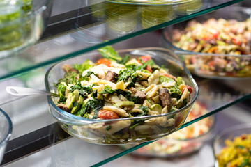 Variety of salad in restaurant shelf 