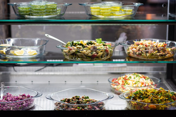 Variety of salad in restaurant shelf 