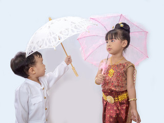 Thai little girl in traditional Thai costume in white background