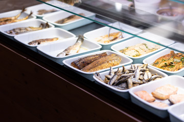 Prepared fish and seafood in shelf of restaurant 
