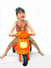 Thai little girl in traditional Thai costume in white background