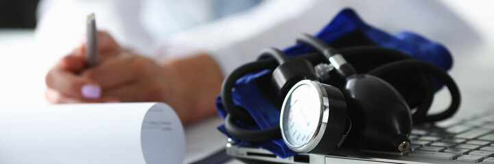 Obraz na płótnie Canvas Tonometer for measuring blood pressure on doctor desk in hospital