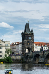Fototapeta na wymiar Gothic style old town bridge tower one of the most beautiful Gothic gateways in the world, at the east side of Charles Bridge across the Vltava river in Prague, Czech Republic.