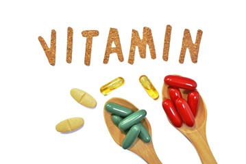 Vitamin capsules on a white background. Vitamin B, C, zinc, iron, fish oil.