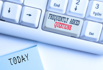 Conceptual hand writing showing Frequently Asked Questions. Concept meaning inquries that been informed more than one time White pc keyboard with note paper above the white background