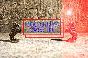 Text sign showing Local Business Marketing. Business photo showcasing Localized specification on Store characteristic Two Bronze Chess Pieces Knights Facing Each Other in Focus and Defocused