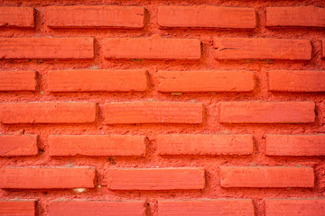 Obraz premium Brick wall painted with bright red for making the background
