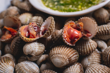 Scalding clams are appetizing red with a delicious spicy sauce.
