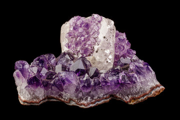 Fototapeta premium macro mineral amethyst stone with calcite black background