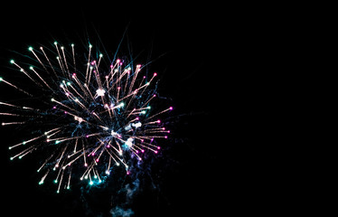 Beautiful colorful holiday fireworks in the night sky. 
