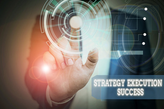Text sign showing Strategy Execution Success. Business photo text putting plan or list and start doing it well Male human wear formal work suit presenting presentation using smart device