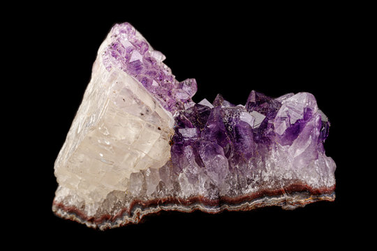 macro mineral amethyst stone with calcite black background