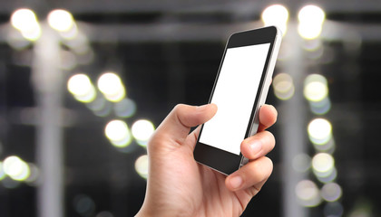 Man hand holding smartphone device touching screen