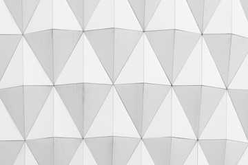 closeup view of white abstract diamond shape pattern architectural wallpaper, background or texture.