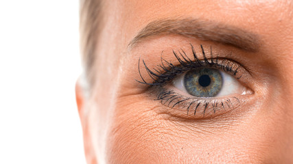 Close up view of an eye of a middle aged woman. Eyesight concept