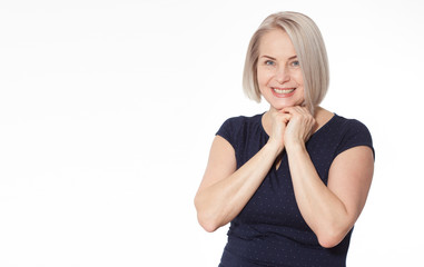 Happy woman emotionally posing in studio. Middle aged woman on white background