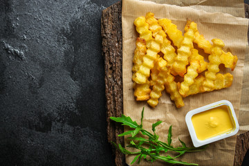 french fries and sauce (delicious snack, fast food, deep fried potatoes) menu concept. food background. copy space. Top view