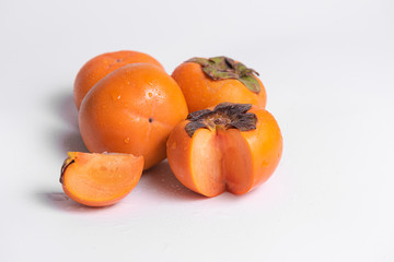 Ripe persimmons isolated on white background