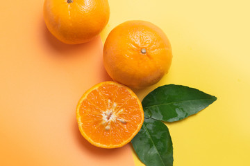 Fresh Orange Fruit isolated on yellow orange color background
