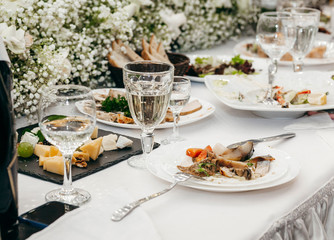Empty dish with fork and spoon on background