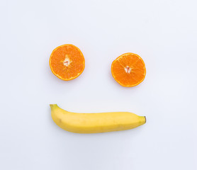 Orange Banana smiley face symbol concept for healthy food