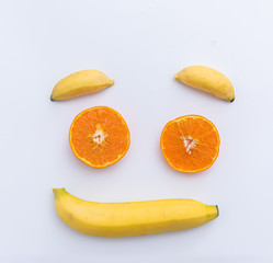 Orange Banana smiley face symbol concept for healthy food