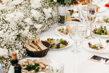Empty dish with fork and spoon on background