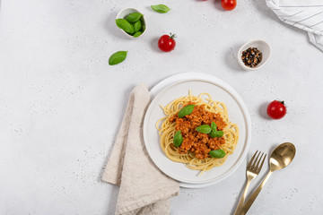Pasta Bolognese. Spaghetti with meat sauce and basil. Traditional Italian dish. Top view, copy space. For menu