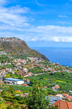 Stunning view of Arco da Calheta, Madeira Island, Portugal. A beautiful village located on a hill above the Atlantic ocean. Green banana plantation. Portuguese landscapes. Tourist destinations