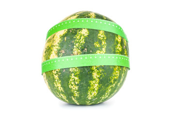 Ripe watermelon with measuring length isolated on white background